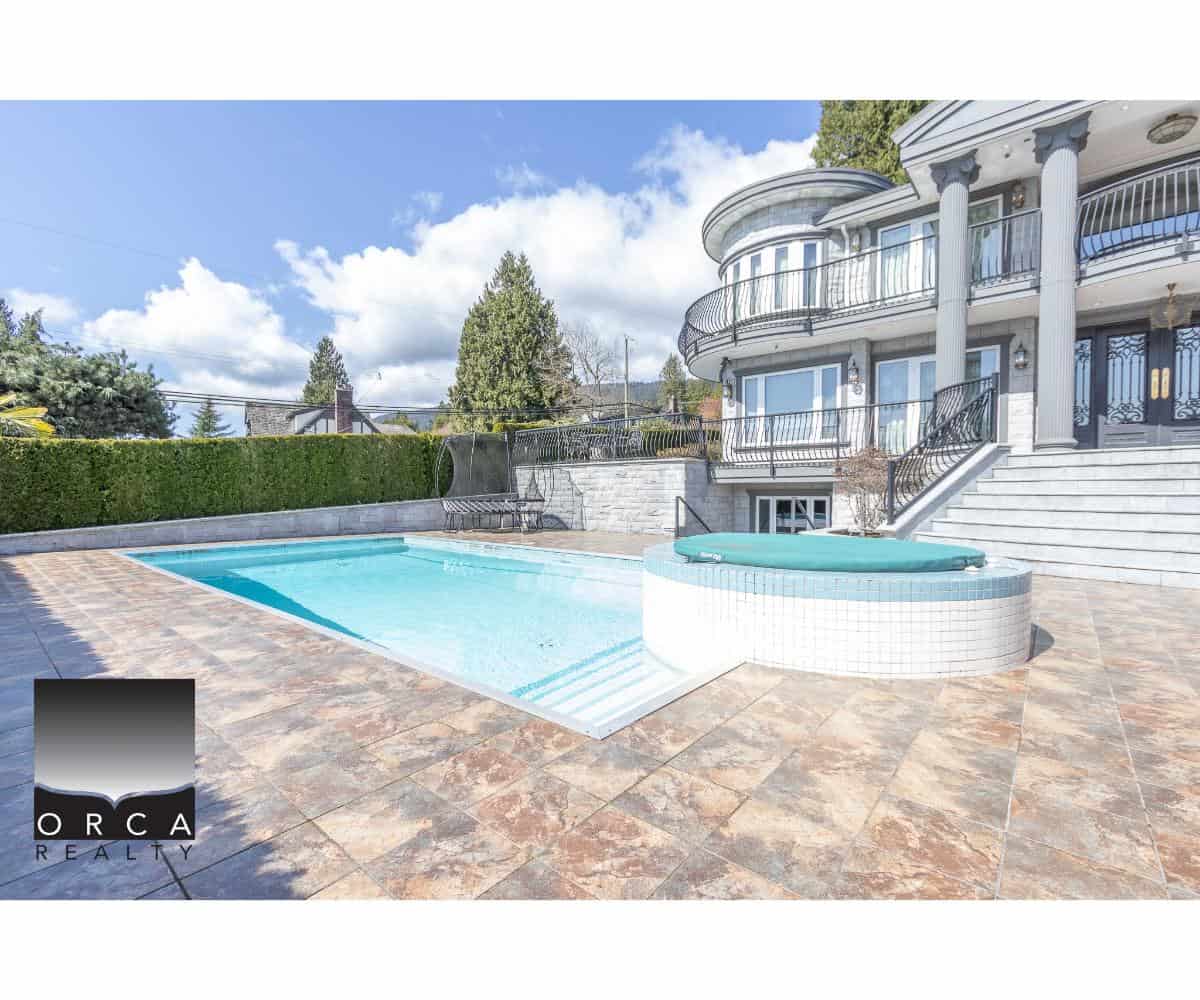 Luxury Vancouver Island home with private swimming pool and spa, outdoor entertaining area, elegant architecture, scenic views, and upscale amenities perfect for real estate investment.