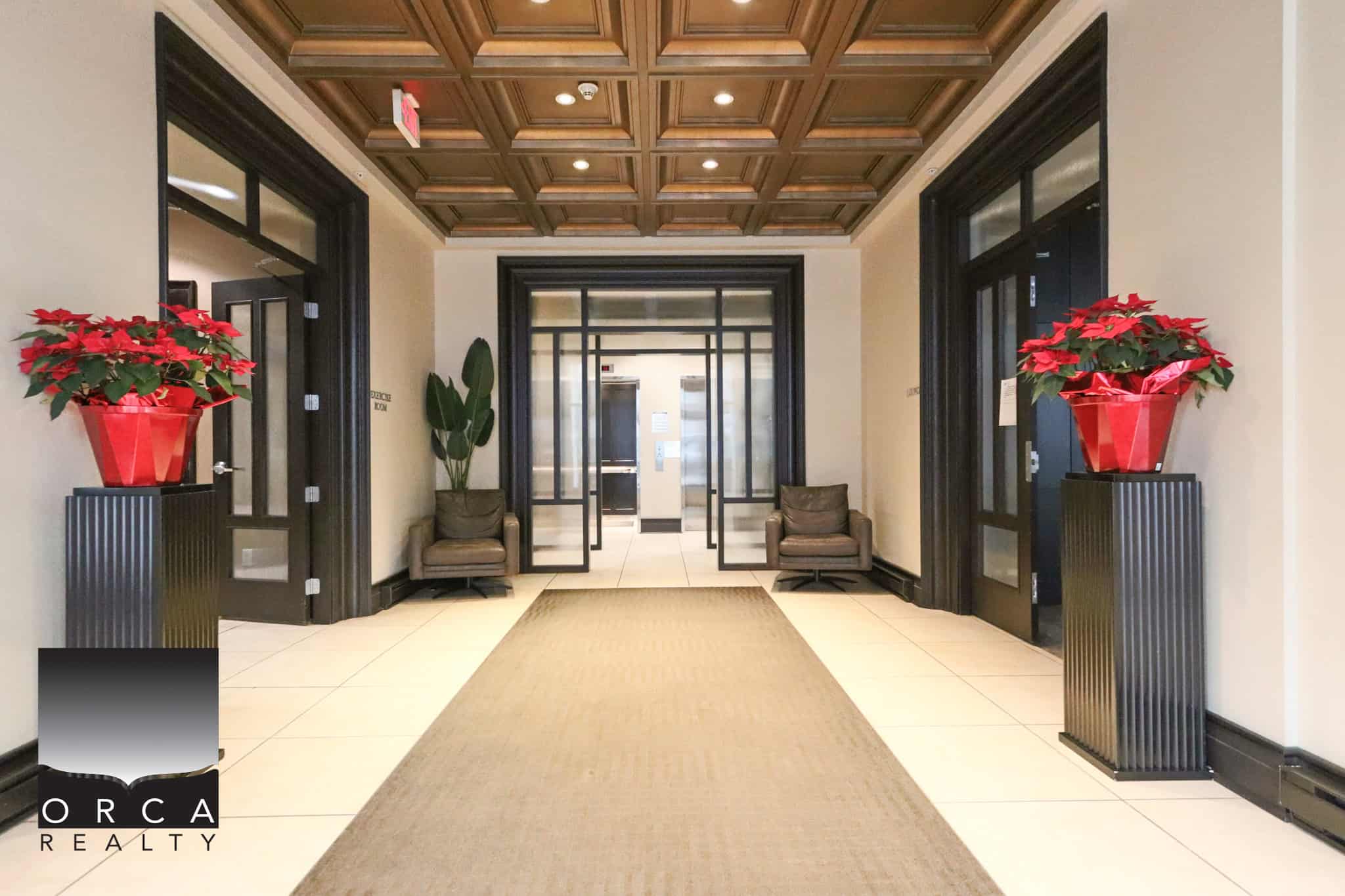 Spacious and elegant office lobby in North Vancouver with stylish decor, wooden ceiling, and large windows, showcasing professional commercial real estate space at 203-170 W 1st Street.