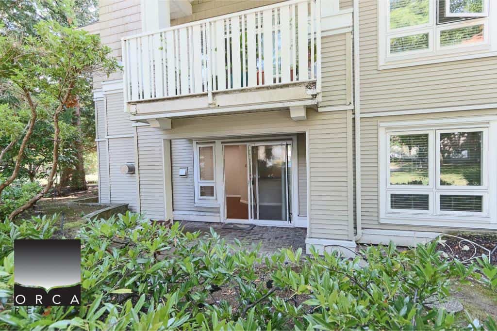 Spacious condominium with private backyard and patio, ideal for urban living in the Vancouver area. Modern amenities and natural surroundings enhance this desirable Orca Realty Inc. listing.