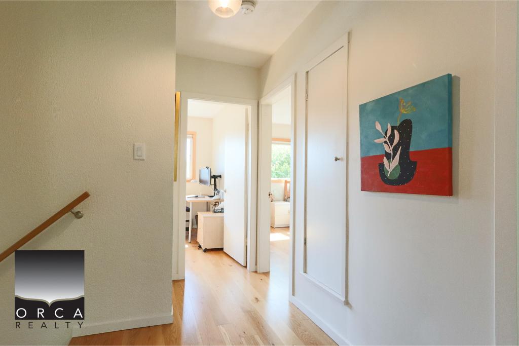 Bright hallway in a modern Canadian home featuring minimalist decor and natural light, ideal for real estate listings showcasing interior design and property features.