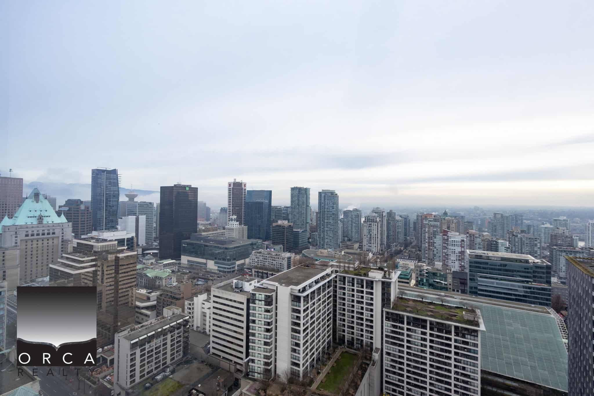 Vibrant Vancouver city skyline with modern high-rise buildings, showcasing urban living and real estate opportunities in downtown Vancouver. Perfect for real estate investment and property search in BC.