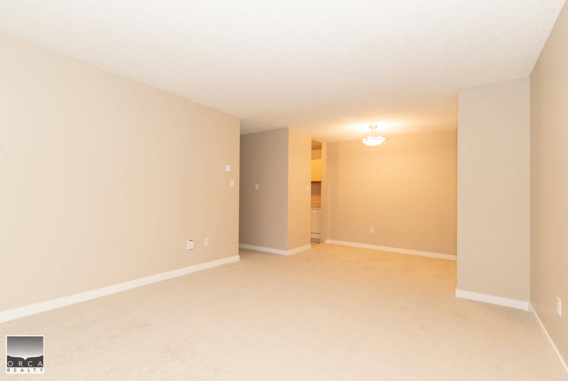 Bright, spacious living room in a Vancouver-area home listed by Orca Realty Inc., showcasing modern interior design perfect for family living and entertaining.