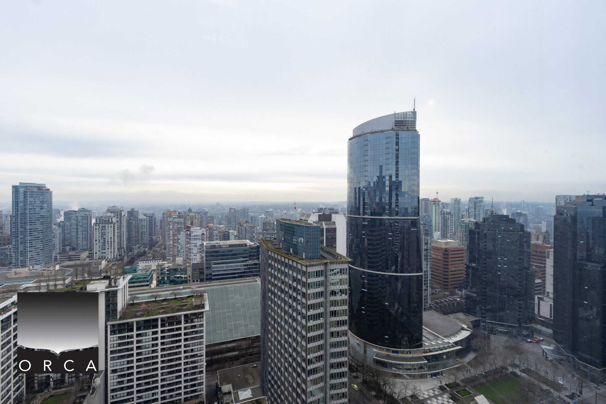 Modern downtown Vancouver city skyline with high-rise buildings and Office Tower, showcasing prime commercial real estate and urban living opportunities.