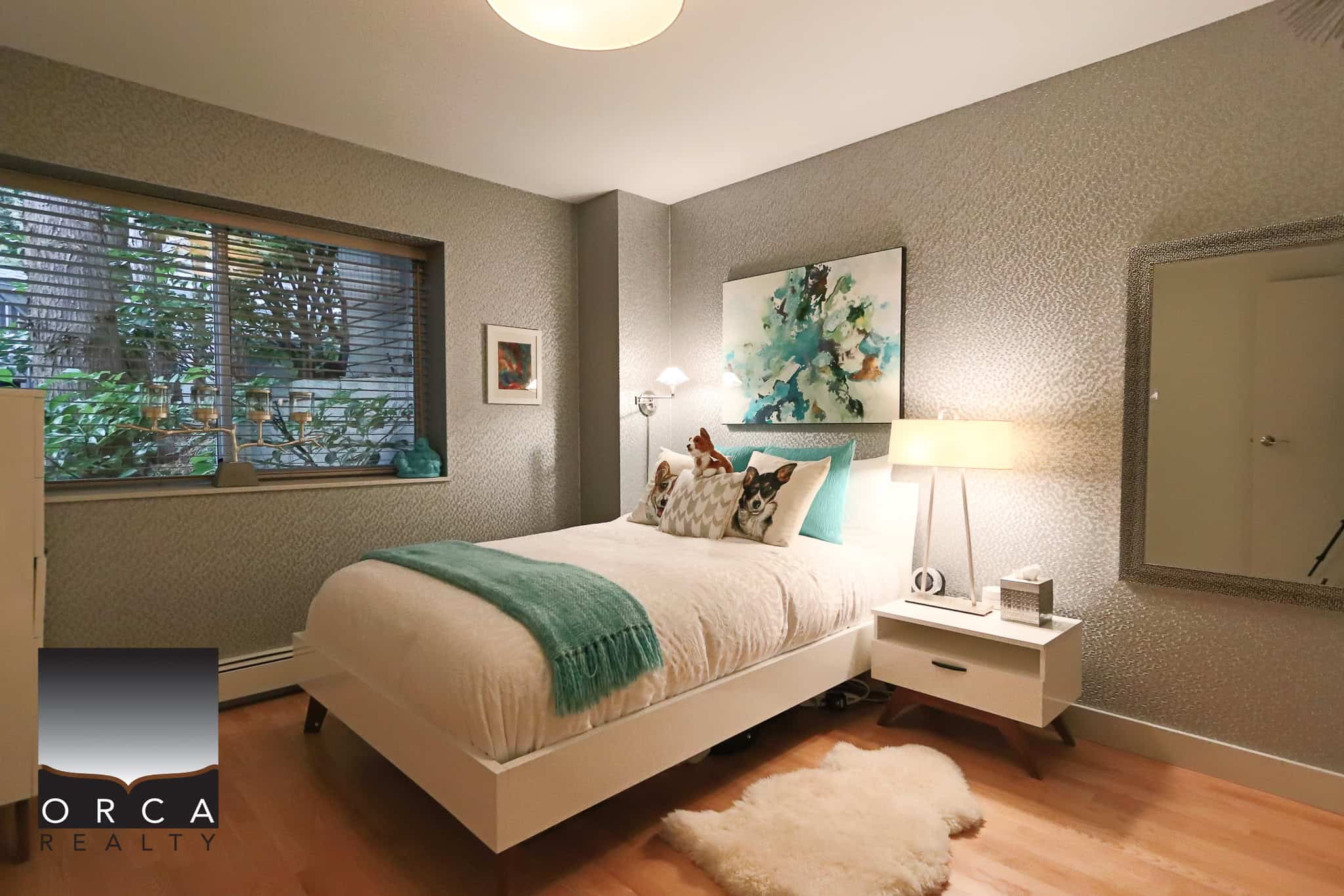 Cozy modern bedroom with textured wallpaper, large window with greenery view, stylish decor, and contemporary furniture, perfect for Vancouver homebuyers seeking comfort and elegance.