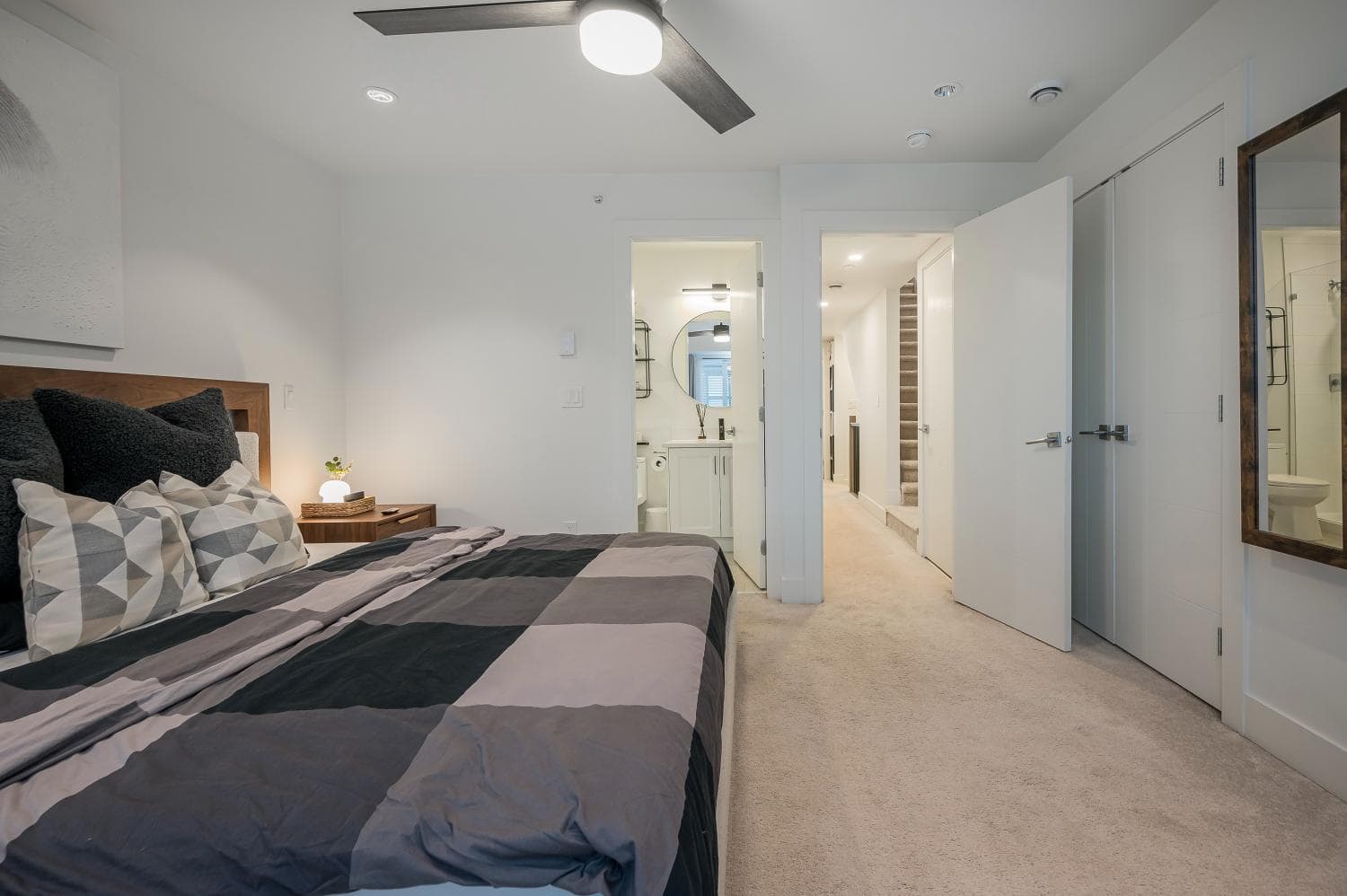 Modern bedroom with ensuite bathroom and walk-in closet in a contemporary Vancouver home for sale by Orca Realty Inc.