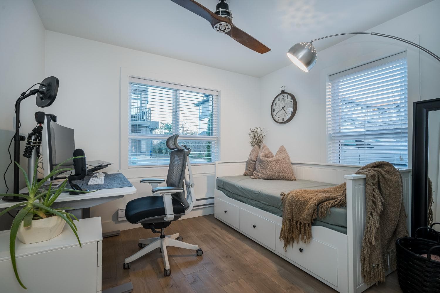 Modern home office with a daybed, computer setup, and natural light, ideal for remote work or guest relaxation in Vancouver, BC.