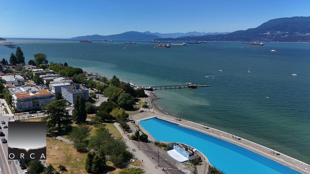 Modern waterfront condo with stunning ocean views in Victoria, BC, featuring an outdoor pool, lush green spaces, and easy access to the pier, perfect for luxury living and investing near Orca Realty Inc.
