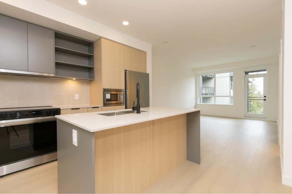 Modern open-concept kitchen with sleek cabinetry, stainless steel appliances, and bright natural light in Vancouver home.