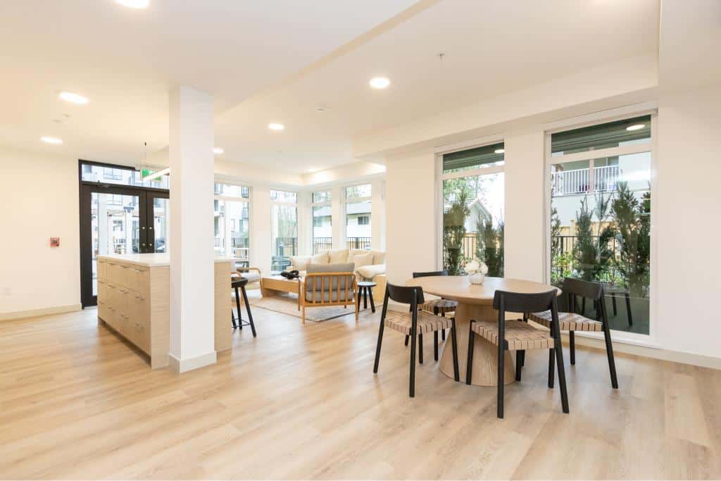 Bright and modern interior of Orca Realty Inc. residential living space featuring spacious seating, large windows, and contemporary decor in a Vancouver area property.