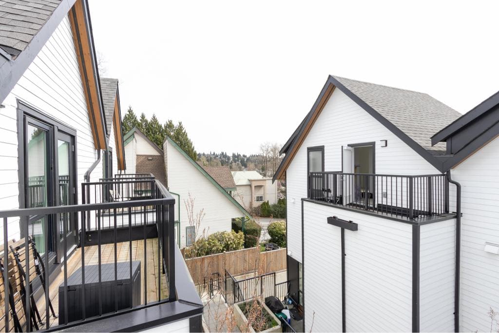 Modern Canadian suburban homes with outdoor balconies in a quiet neighbourhood - perfect for real estate investments.