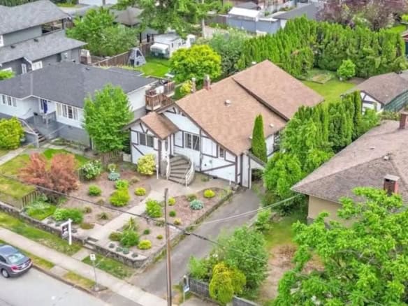 Charming suburban neighborhood with well-maintained homes and lush greenery, ideal for real estate investments in Vancouver.
