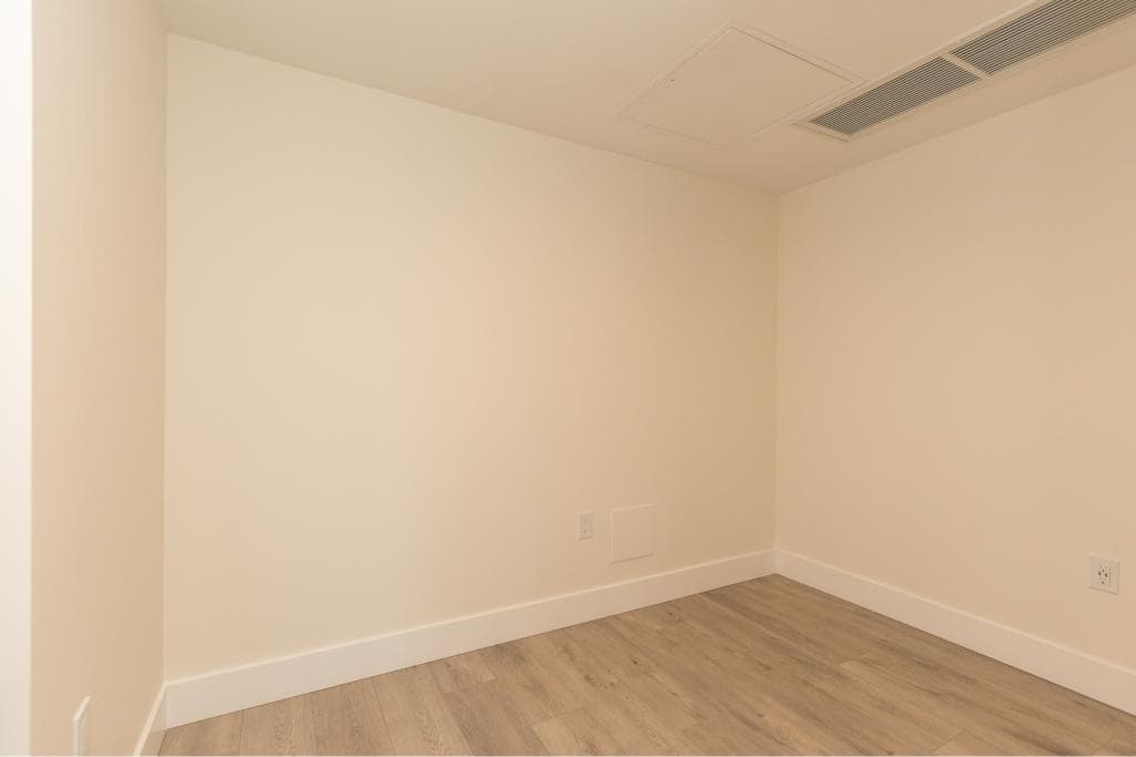 Bright and clean empty room in a modern Vancouver home, perfect for real estate staging or rental listings, showcasing interior design, flooring, and lighting.