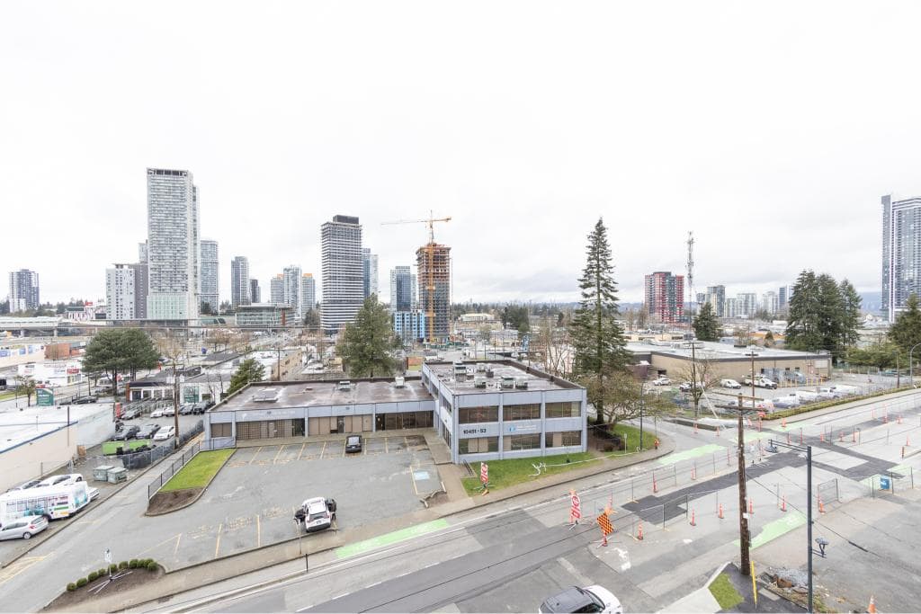 Modern urban cityscape featuring high-rise buildings and ongoing construction, ideal for commercial real estate insights in Vancouver, BC, by Orca Realty Inc.