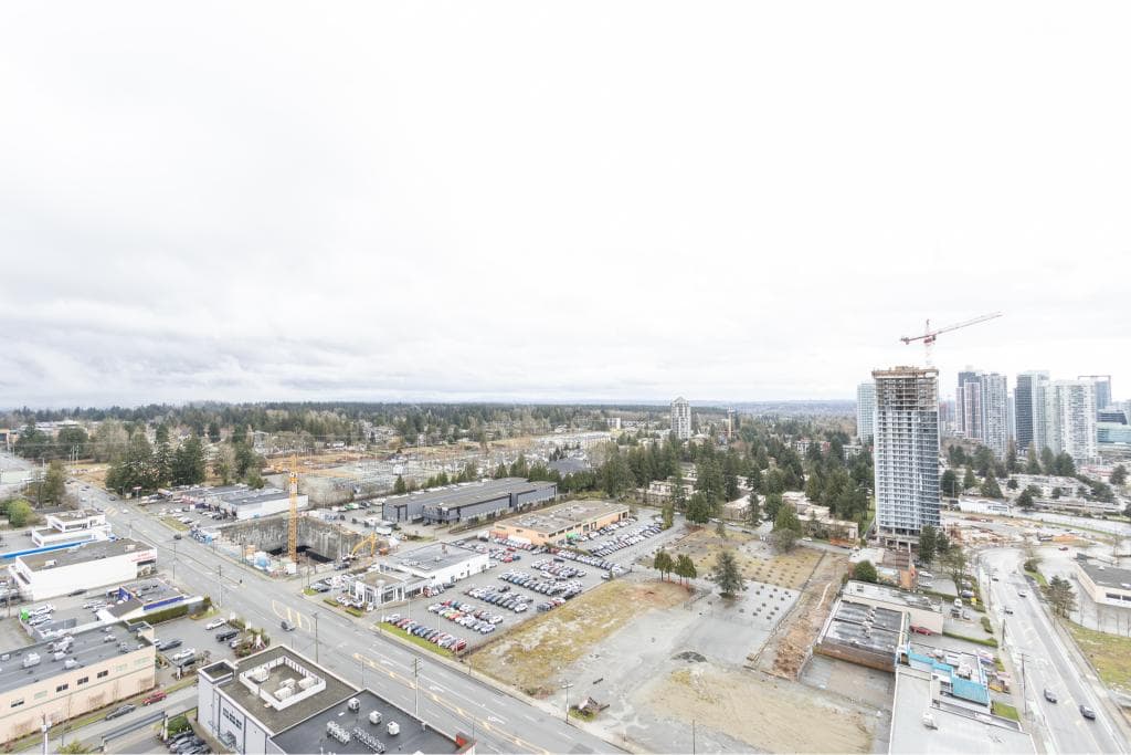 Aerial view of urban development and construction sites in Vancouver, showcasing new high-rise buildings, commercial properties, and ongoing real estate projects in the city.