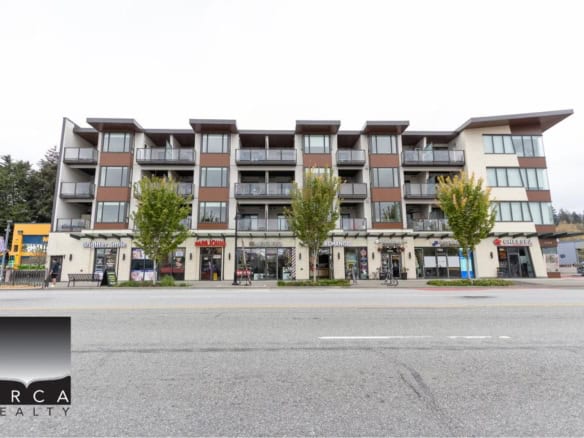 Modern mixed-use residential and commercial building in Victoria, BC with retail shops and apartments, ideal for real estate investment and urban living.