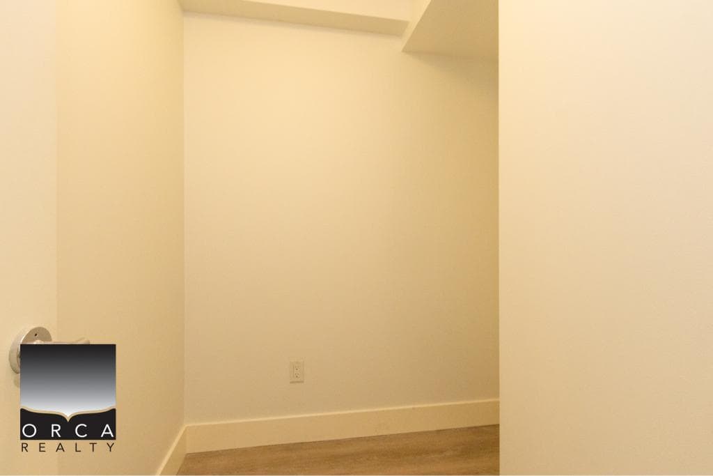 Bright, minimalist interior space at 407-231 E Pender St, Vancouver, showcasing a clean, open layout ideal for urban living.