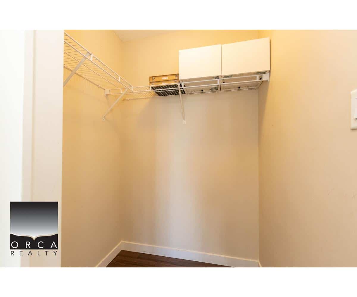 Closet interior with wire shelving and storage cabinets for Vancouver real estate listings.