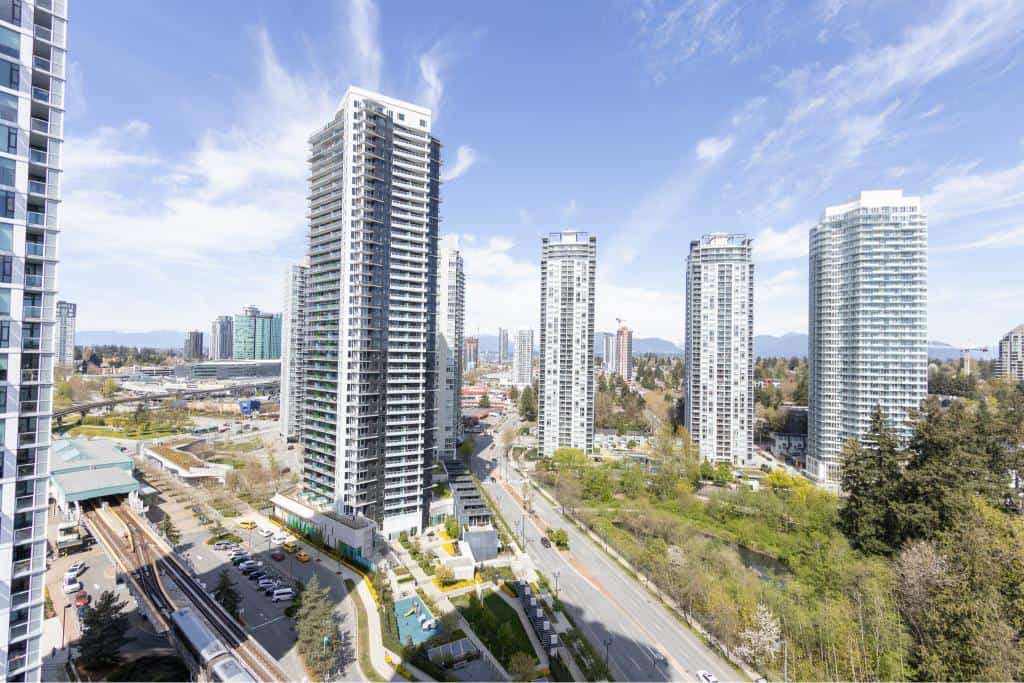 Modern high-rise condominiums in Vancouver’s skyline showcasing luxurious real estate options by Orca Realty Inc.