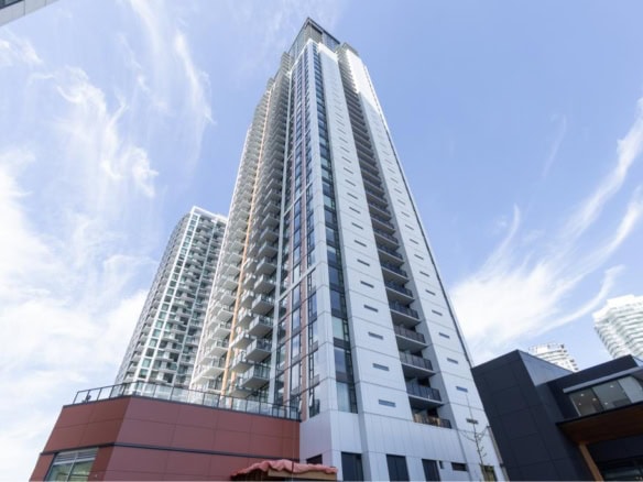 Luxury high-rise residential building in downtown Vancouver, BC, featuring modern architecture, spacious condos, and panoramic city views. Perfect for Toronto, Vancouver, and Victoria real estate investments.