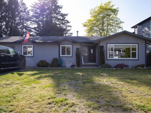 Charming single-family home for sale in Victoria, BC, featuring a beautifully landscaped yard, modern exterior design, and prime location near amenities and parks, offered by Orca Realty Inc.