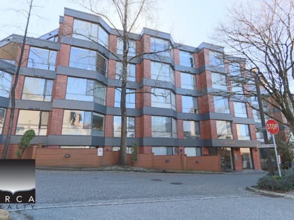 Spacious Vancouver apartment building featuring contemporary brick and glass architecture, located at 404-2140 Briar Avenue, offering prime real estate options in Vancouver.