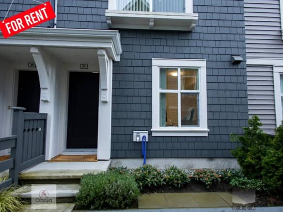 Modern attached duplex home available for rent with stylish exterior, inviting entryway, and well-maintained landscaping in a desirable neighbourhood. Perfect rental property by Orca Realty Inc.