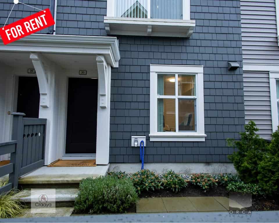 Modern attached duplex home available for rent with stylish exterior, inviting entryway, and well-maintained landscaping in a desirable neighbourhood. Perfect rental property by Orca Realty Inc.