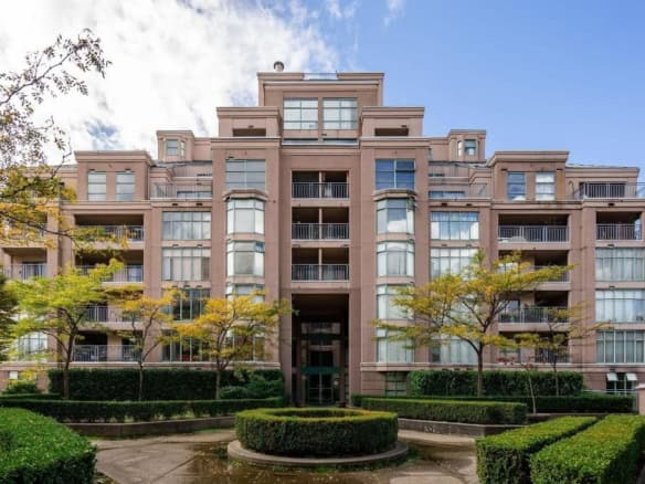 Luxury apartment building in Vancouver, modern residential complex with landscaped gardens, tall windows and spacious balconies, part of Orca Realty Inc.'s property portfolio in BC.