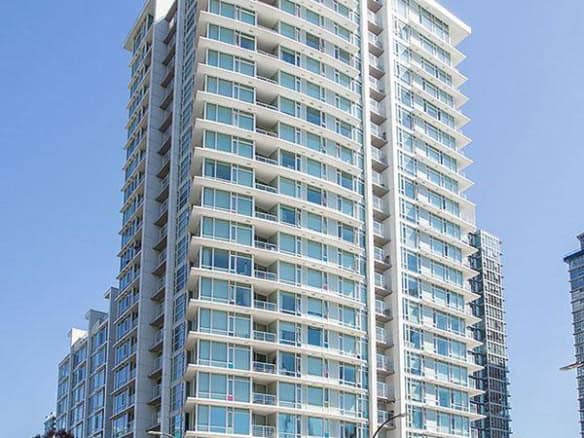 Luxury modern high-rise condo building in Vancouver, featuring glass balconies and sleek architecture, perfect for urban living and real estate investment in British Columbia.