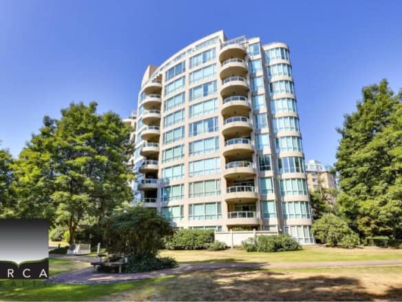 Modern waterfront condominium building in a picturesque Vancouver park setting, offering luxury living, spacious balconies, and stunning views, ideal for Vancouver real estate buyers.