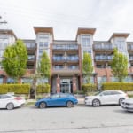 Modern multi-family residential building with apartment units and balconies in a trendy Vancouver neighbourhood, showcasing vibrant urban living.