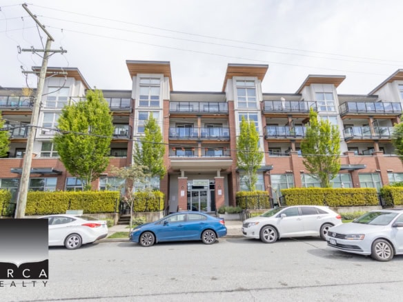 Modern multi-family residential building with apartment units and balconies in a trendy Vancouver neighbourhood, showcasing vibrant urban living.