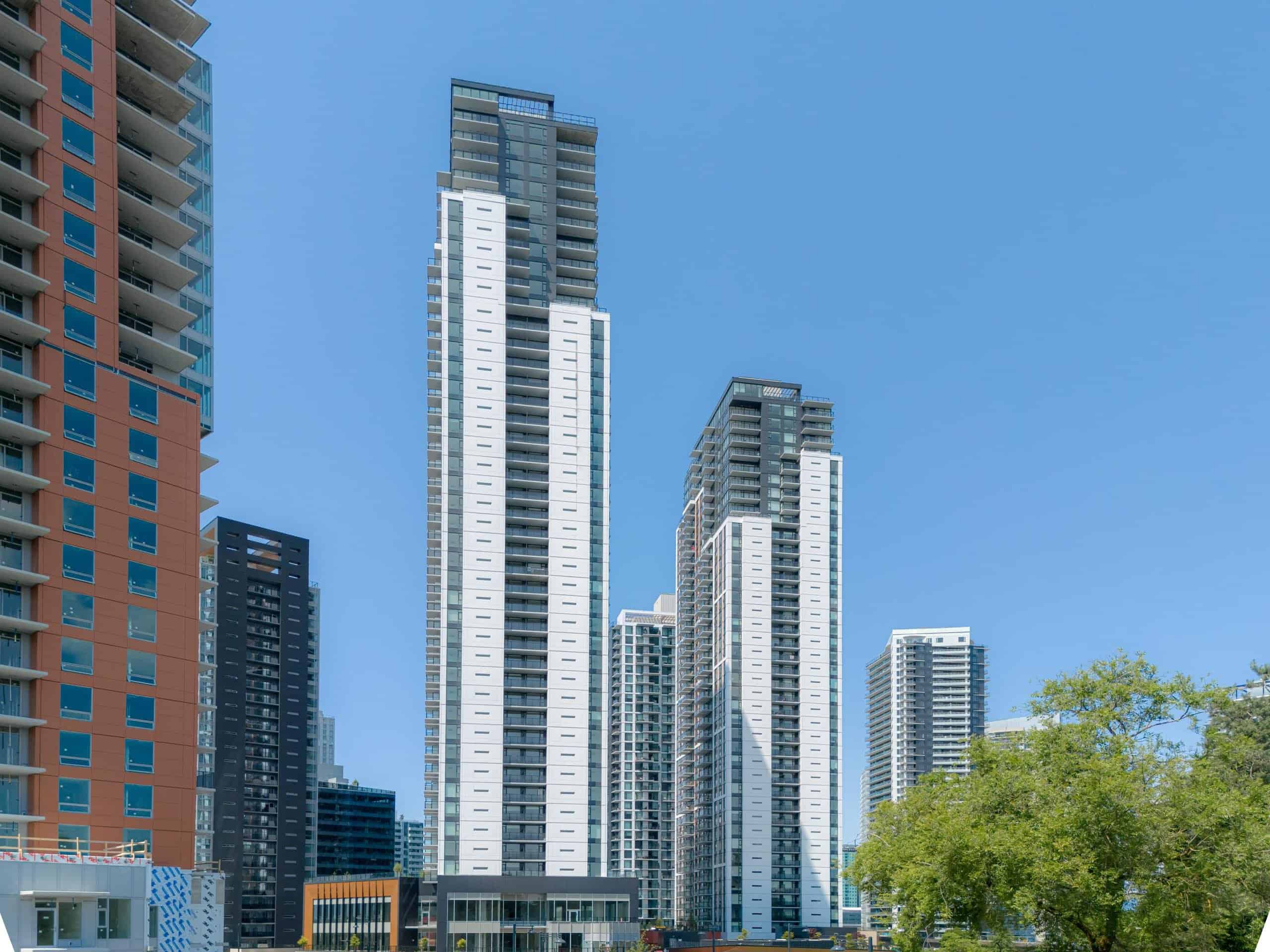 Modern high-rise condominium buildings in downtown Vancouver showcasing contemporary architecture, ideal for real estate investors and homebuyers interested in Vancouver property market.