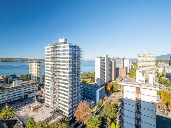 Modern high-rise waterfront apartment building in Victoria, BC with stunning views and luxury amenities. Prime real estate opportunity with scenic city and water landscape.
