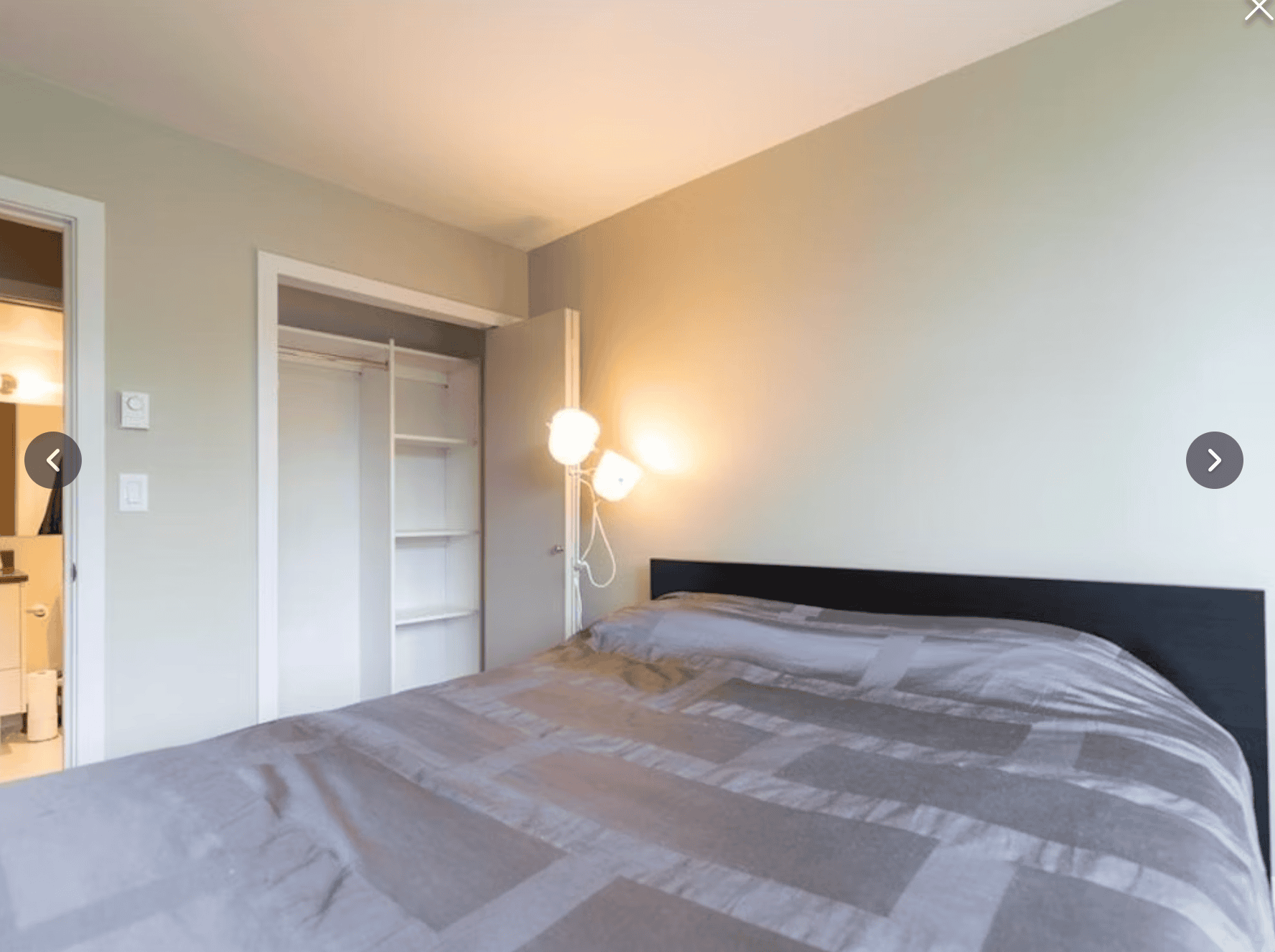 Cozy bedroom in Vancouver property listed by Orca Realty Inc., featuring a large bed, modern decor, and ample storage space, perfect for home buyers or renters looking for Vancouver real estate.