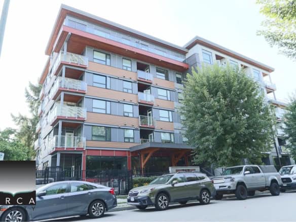 Modern Vancouver apartment building with spacious balconies and large windows, surrounded by greenery in a desirable neighbourhood. Well-maintained exterior perfect for urban living.