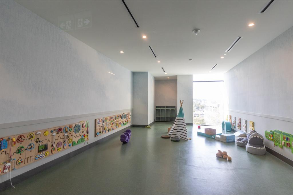 Bright indoor children’s playroom with educational toys, colorful decor, and natural light, ideal for family-friendly properties offered by Orca Realty Inc.