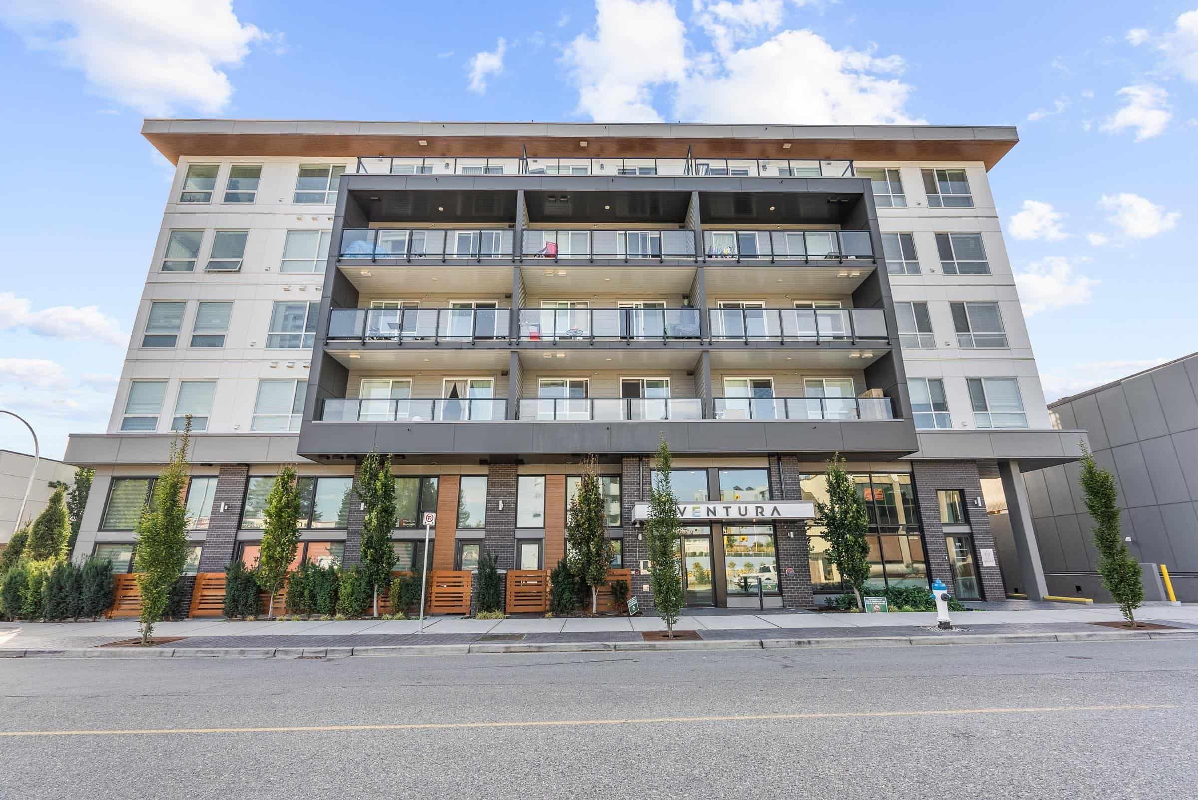 R2841847-1 Modern multi-story residential building with balconies in Vancouver, BC, featuring contemporary architecture, urban living space, and eco-friendly design, ideal for real estate investment.