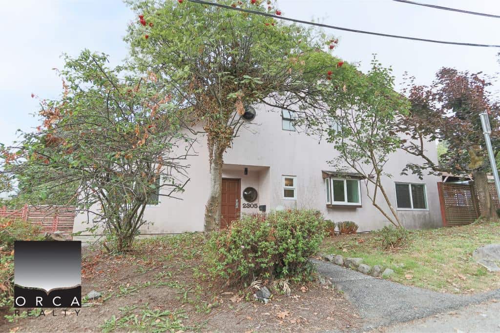 Charming residential home listed by Orca Realty Inc., showcasing a cozy exterior with mature trees and well-maintained landscaping in a peaceful neighbourhood.