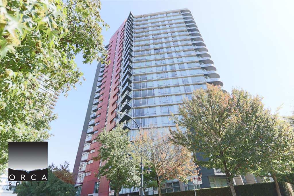 Modern high-rise condominium building in Vancouver, BC, showcasing upscale urban living with balconies and glass exterior, perfect for real estate investment or residential purposes.