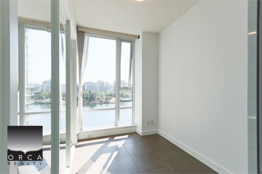 Stunning waterfront view from a modern condo in Vancouver offered by Orca Realty Inc.