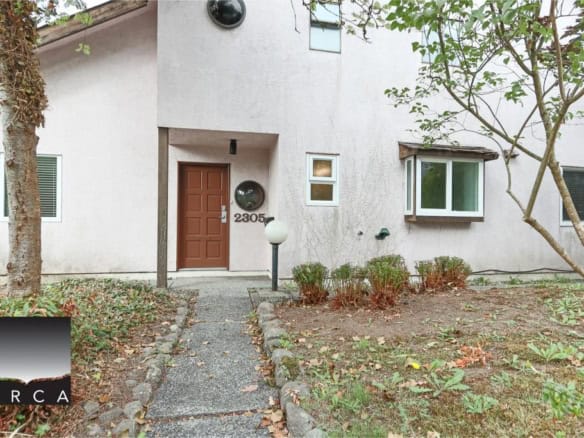 Modern residential property with a welcoming entrance in a quiet neighbourhood, ideal for buyers seeking privacy and comfort in their home.