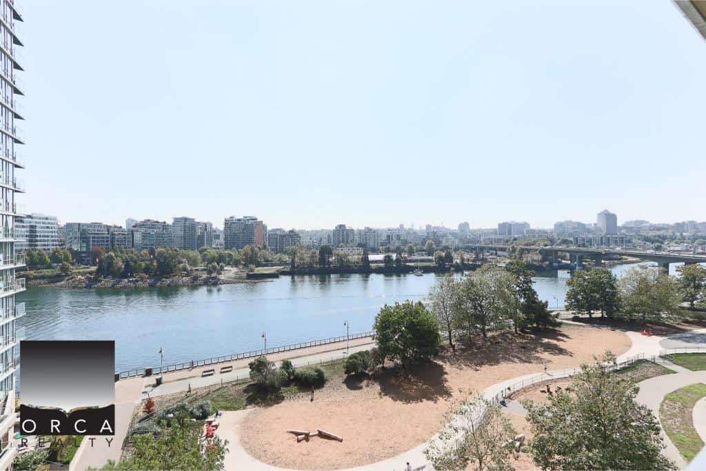 Stunning waterfront view of the river and city skyline, ideal for Vancouver real estate investments and luxury condo listings by Orca Realty Inc.