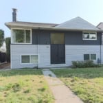 Charming duplex home listed by Orca Realty Inc. in a desirable neighbourhood, featuring a modern exterior, well-maintained yard, and convenient location for Vancouver Island real estate buyers.