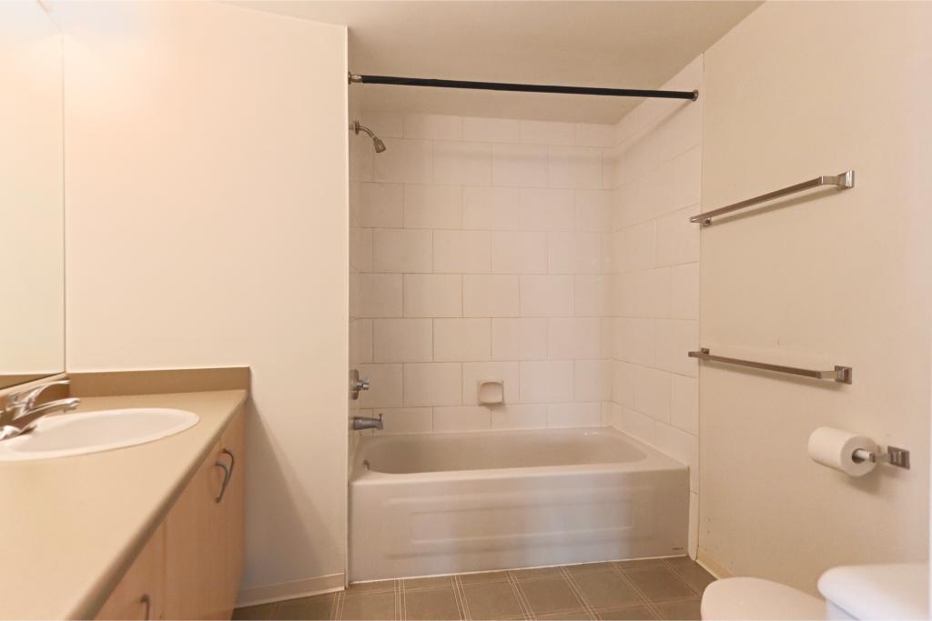 Modern bathroom with bathtub, shower, and minimalist design in Vancouver area. Perfect for real estate listings and property showcases by Orca Realty Inc. in BC.