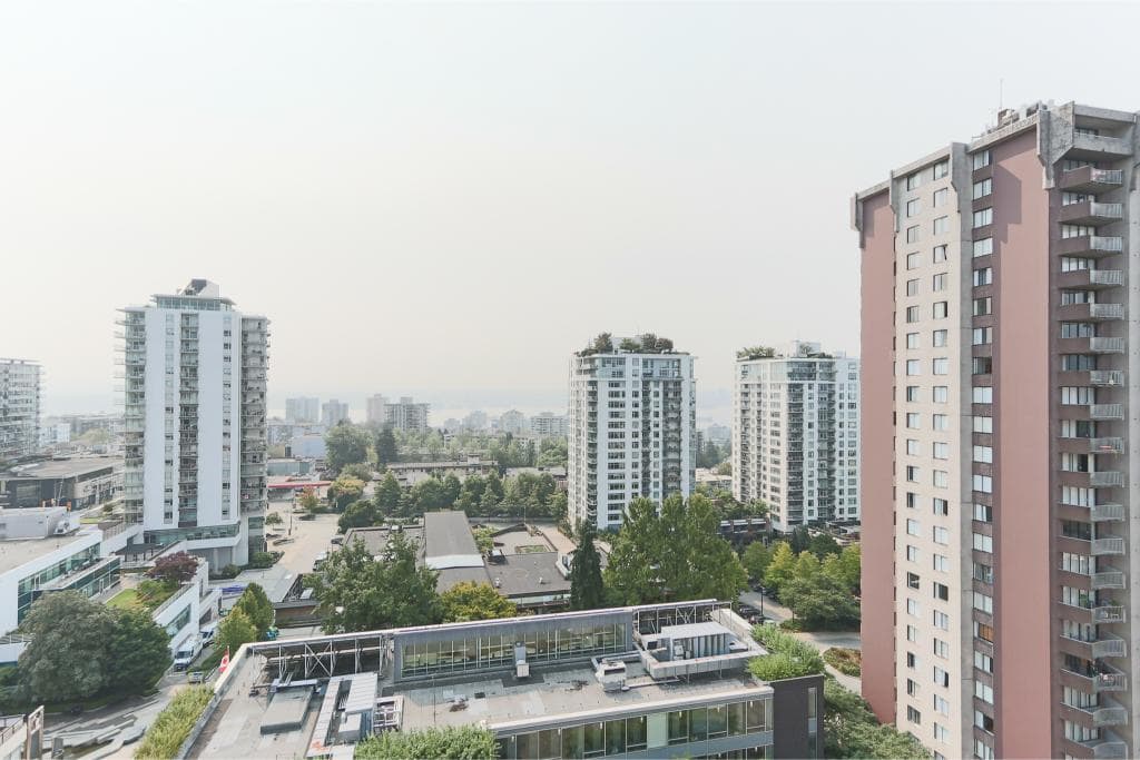 Modern Vancouver high-rise apartment buildings with scenic city views in a vibrant urban neighbourhood. Ideal for real estate investment and rental opportunities.
