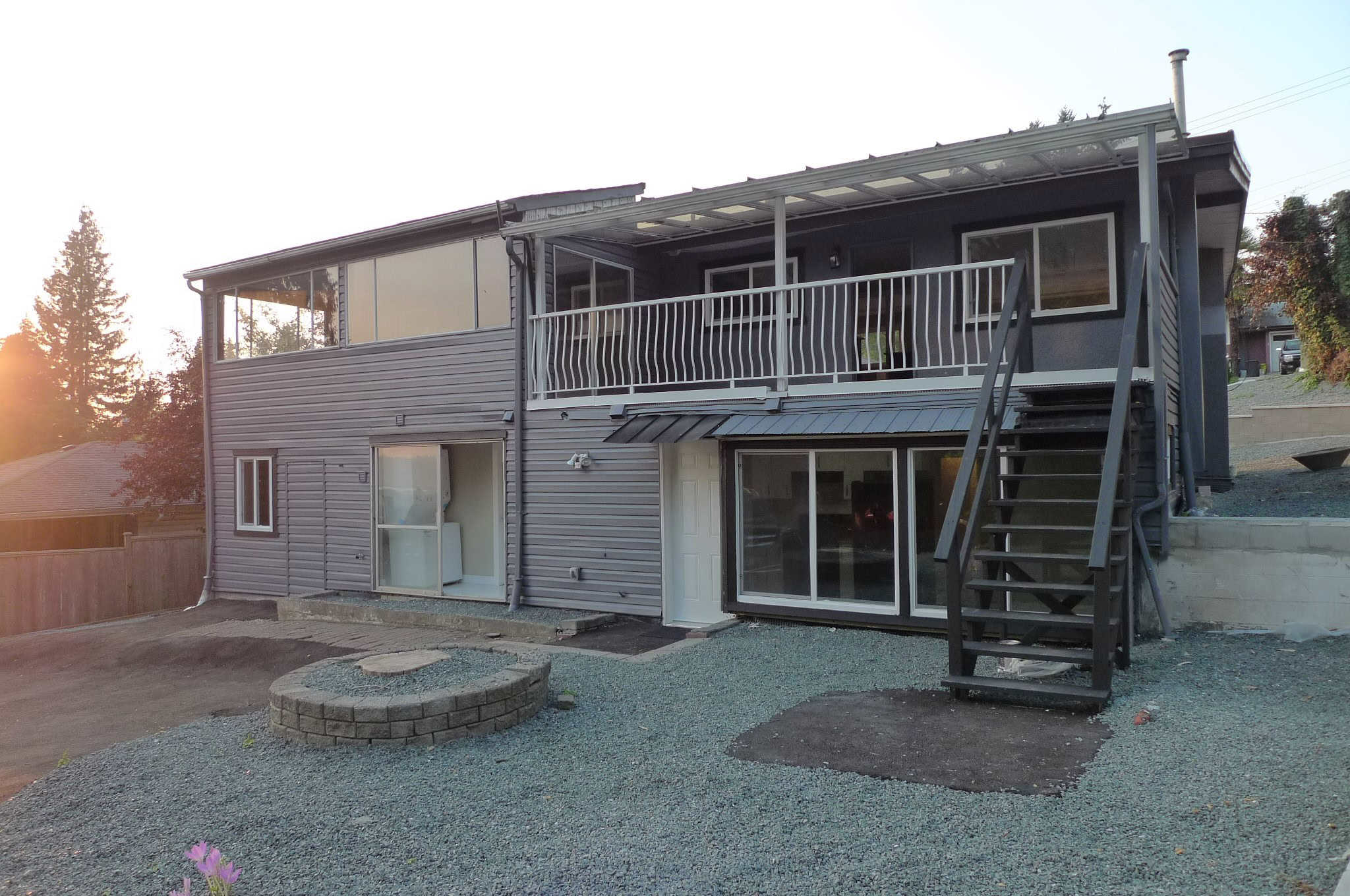 Modern duplex home with updated exterior, spacious upstairs balcony, and a versatile lower level walkout in a desirable residential area in Victoria, BC.