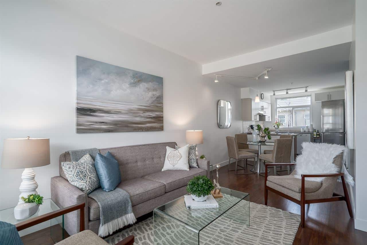 Bright and modern living room interior with cozy furniture and elegant decor in a Vancouver home, showcasing professional real estate staging by Orca Realty Inc.