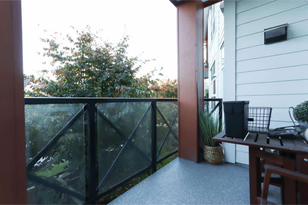 Balcony view featuring modern railings and outdoor decor at Orca Realty Inc. property, perfect for Vancouver real estate investments or waterfront homes.