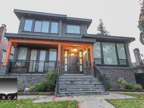 Modern multi-level Vancouver home for sale by Orca Realty Inc., featuring sleek architectural design, large windows, and landscaped front yard.